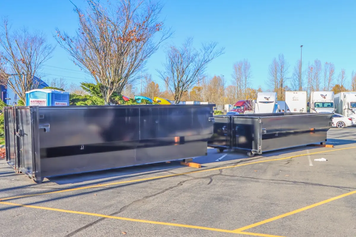 Professional dumpster rental service with roll-off container on residential driveway in Upper Sandusky
